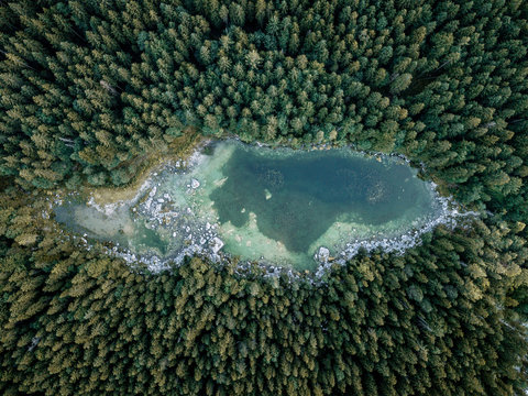 Lake Eibsee in south Germany with large forest and hidden lakes after sunset