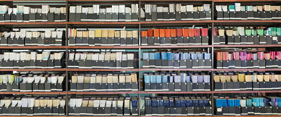 Shelves with old books in a library
