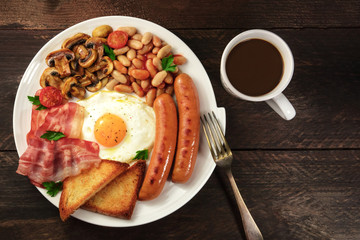 Overhead shot of full breakfast with coffee and copyspace