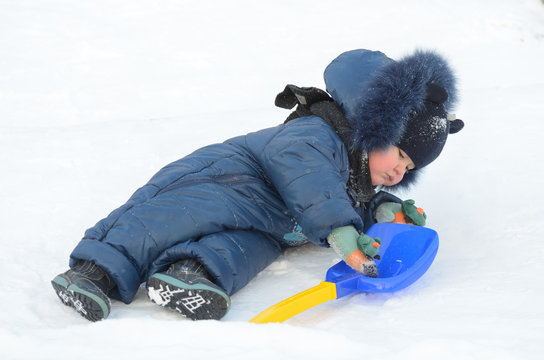 A small child plays on the Playground.