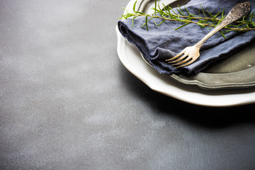 Summer time table setting with fresh rosemary