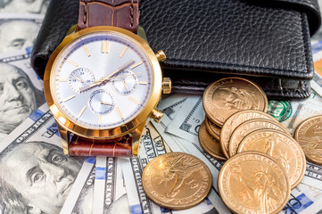 Wrist watch with wallet on dollars.