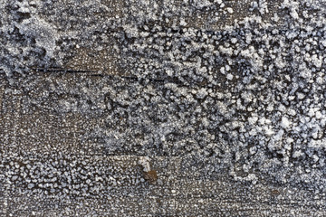 Beautiful frost crystals on wood close-up texture background