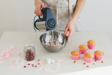 Girl prepares cupcakes