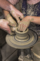 Potter and pupil's hands