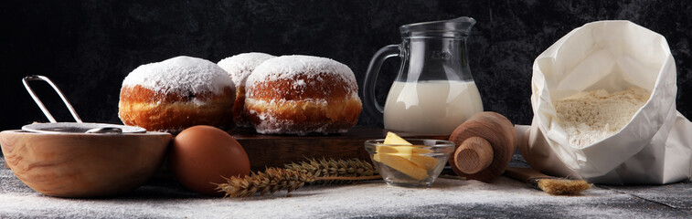 german donuts or berliner with ingredient on grey background