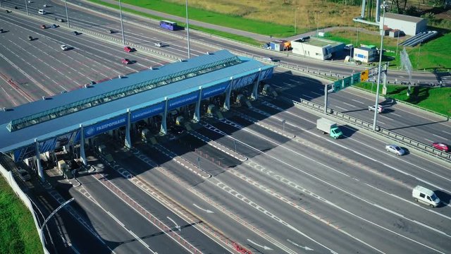 Drone view car traffic on checkpoint at toll road in modern city aerial view