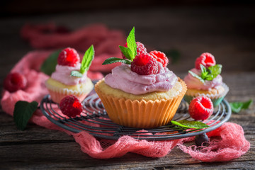 Closeup of raspberry muffin made of cream and fruits