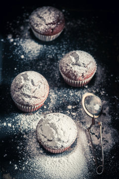Yummy and sweet brown muffin with powdered sugar