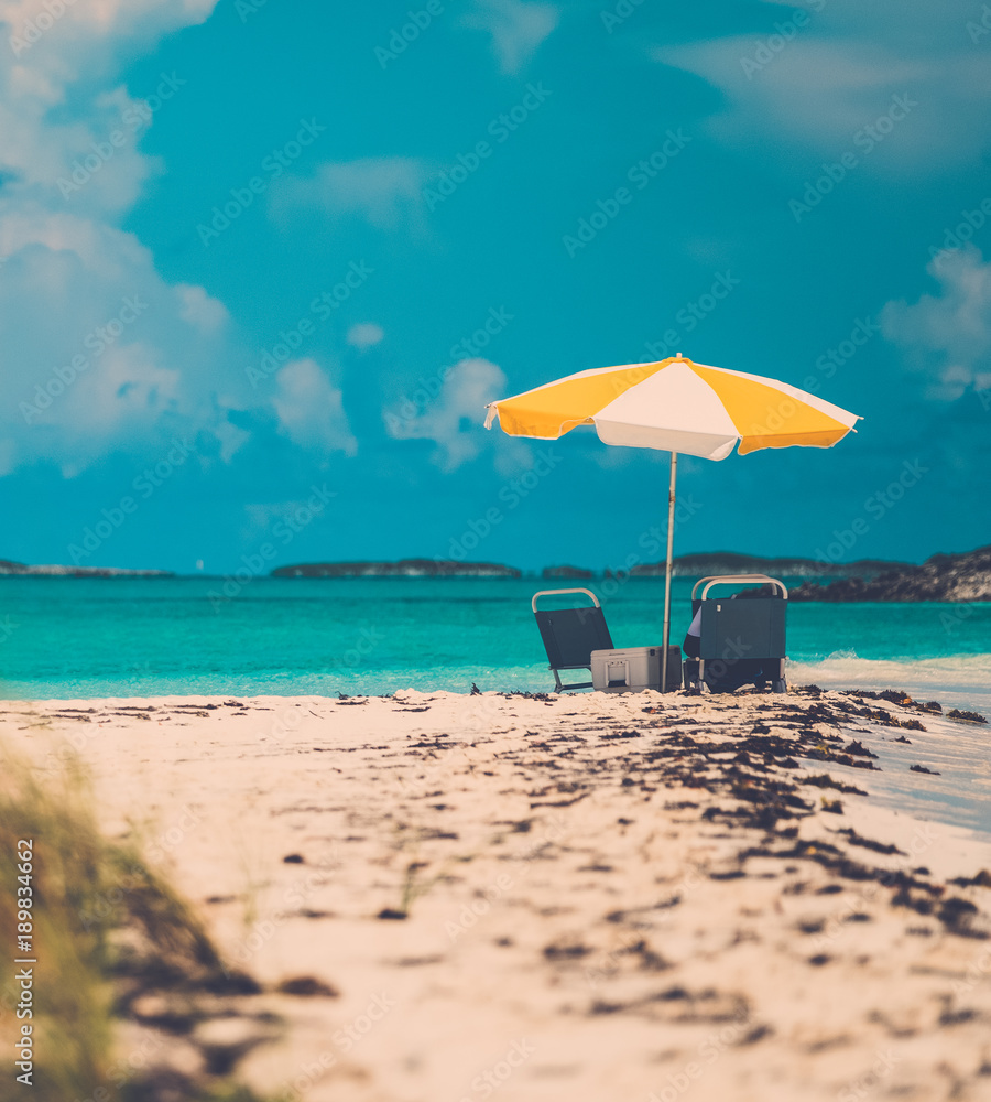 Wall mural sun umbrella on a tropical beach