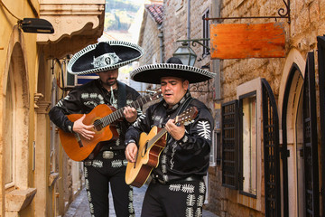 Mexican musicians mariachi on a city street