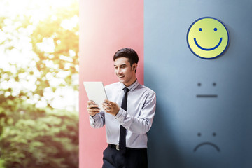 Customer Experience Concept, Happy Businessman Enjoying on digital Tablet with Smiley Face Rating...