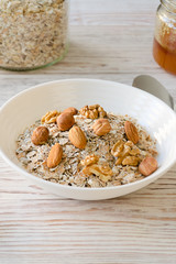 Bowl of muesli and nuts with honey.