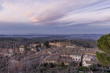 Fototapeta na wymiar Aerial view of San Gimignano and the Church of Sant'Agostino at sunset, Siena, Tuscany, Italy