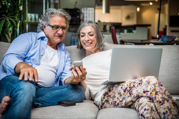 Senior couple shopping online