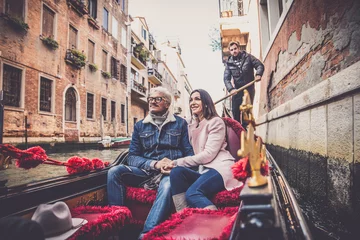 Fotobehang Couple sailing on venetian gondola © oneinchpunch