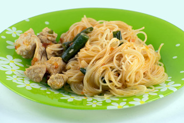 Asian noodles with green beans and turkey. Pad Thai with turkey. Rice noodles.