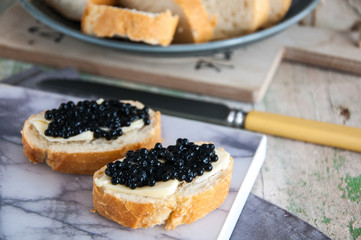 Sandwiches with black caviar