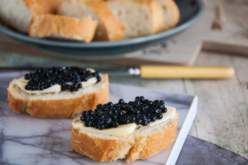 Sandwiches with black caviar