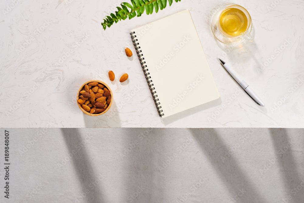 Aufkleber minimal styled flat lay table with open notebook, croissant and tea.