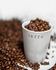 Coffee cup with roasted beans