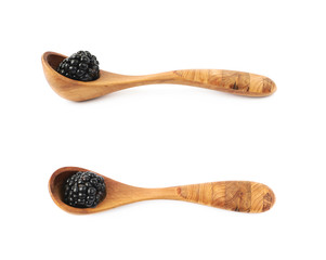 Wooden spoon and blackderry fruit