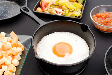 fried egg in iron pan