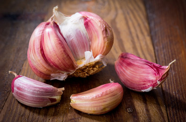 head of garlic on rustic wood