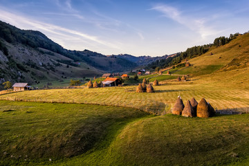 Beautiful rural mountain landscape in the sunrise morning light, Fundatura Ponorului, Hunedoara County, Romania