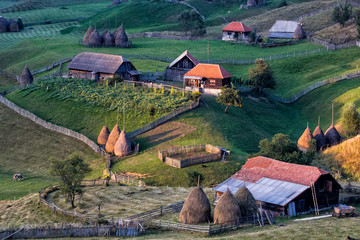 Beautiful rural mountain landscape in the sunrise morning light, Fundatura Ponorului, Hunedoara County, Romania