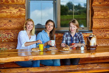 young women drinking tea