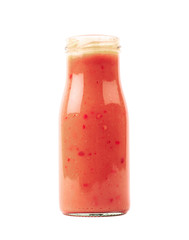 Red sauce in a glass bottle isolated
