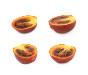 Half of a ripe tamarillo fruit isolated