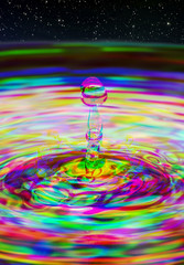 Water drop ripple splash with abstract multi coloured Harris Shutter Effect