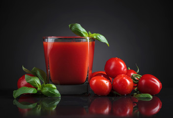 Bloody Mary cocktail garnished with a basil.