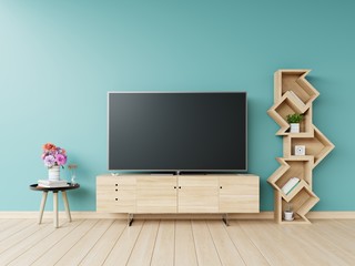 Led tv on cabinet and shelf,table,flower have blue wall,3D rendering