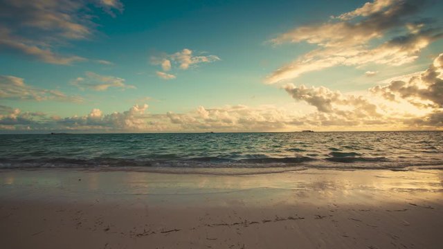 Island tropical beach with white sand and turquoise sea water. Punta Cana, Dominican Republic. Sunrise video.