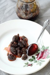 Fresh jam from pine cones in the bowl  