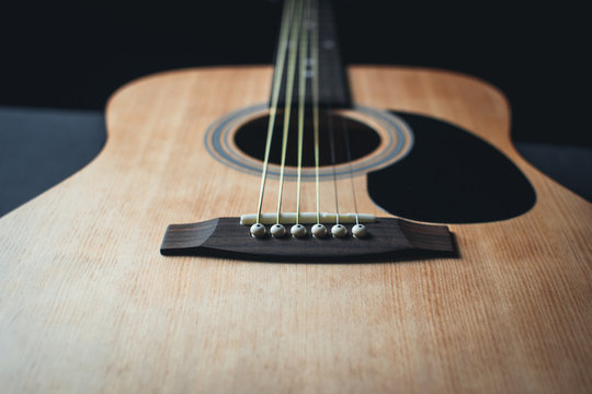 part of the guitar, neck, a grey and black background, beautifully, elegantly