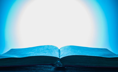 unfolded book with a blue background