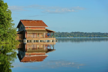 Fototapeta na wymiar Wooden tropical home on stilts over water, Bocas del Toro archipelago, Caribbean sea, Panama, Central America