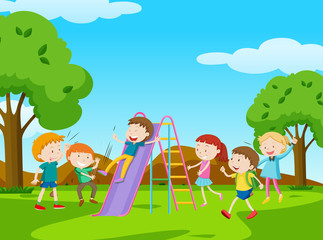 Obraz na płótnie Canvas Children playing slide in park