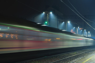 Fototapeta na wymiar EXPRESS TRAIN - The train travels through station