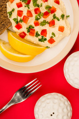 Vegetarian Snack of Hummus with Red Peppers Parsley Lemon and Rye Bread