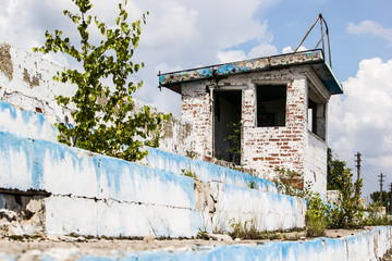 The old destroyed building with no Windows and blue sky