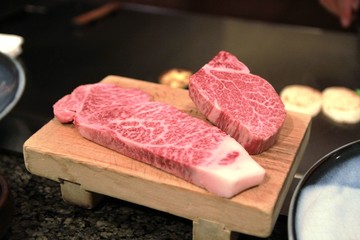 Filet of original Kobe beef on a wooden plate served at a restaurant at Kobe, Japan