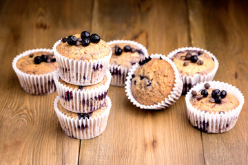 Tasty Muffin Cupcakes with Blueberries on a Wooden Background Pile of Homemade Muffins Horizontal