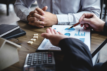 Real estate broker agent being analysis and making the decision a home estate loan to customer to...