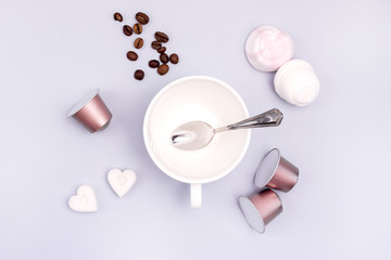Top View Coffee Cup Coffee Capsule Coffee Beans Sugar in Shape of Hearts Marshmallow Coffee Concept Background Blue Background Flat Lay