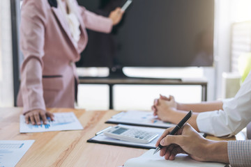 Business adviser presenting and analyzing financial figures denoting the progress in work of company, business concept